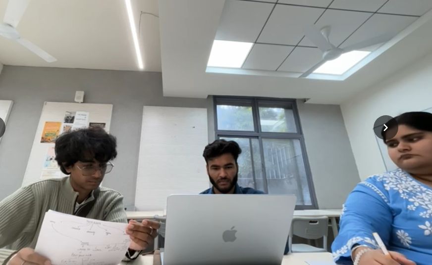 A participant working through a task while the moderator and note-taker watch